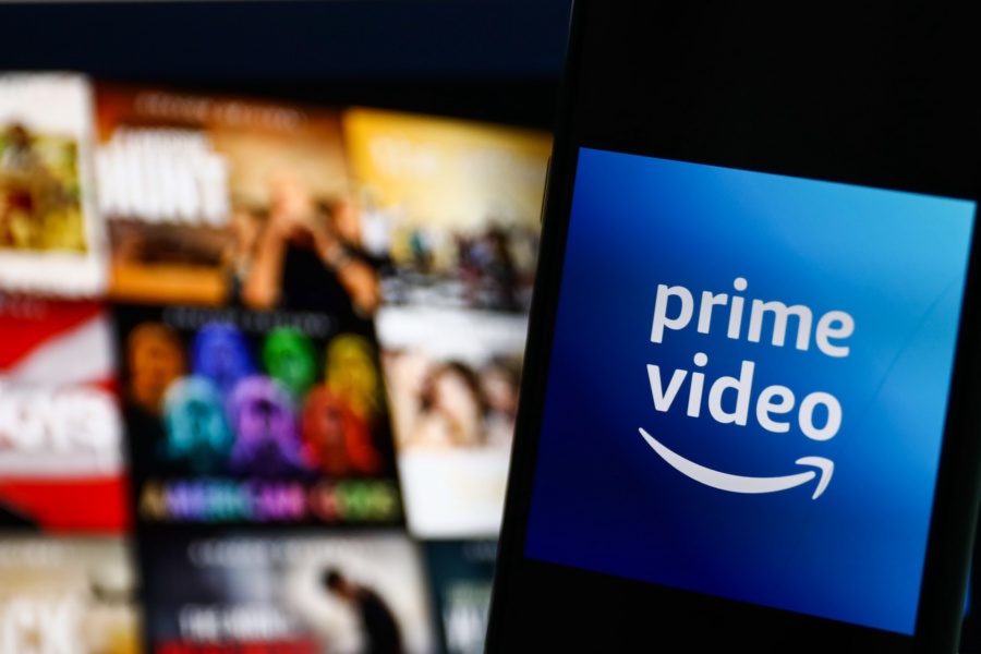 Amazon Prime Video logo displayed on a phone screen and Amazon Prime Video website displayed on a screen in the background are seen in this illustration photo taken in Krakow, Poland on July 26, 2022. (Photo by Jakub Porzycki/NurPhoto)