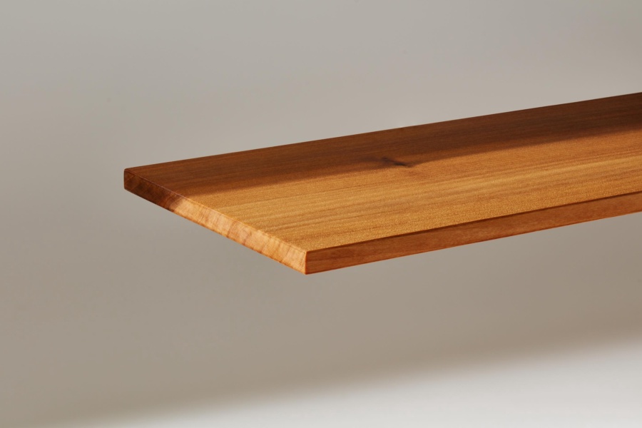 A plank of InventWood Superwood stands against a white background.