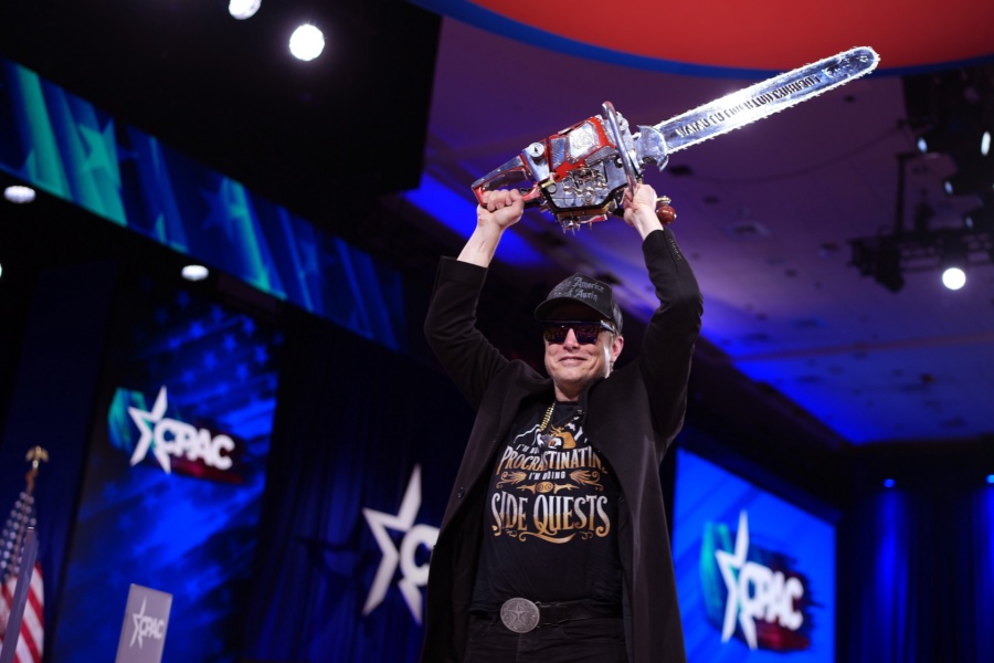 OXON HILL, MARYLAND - FEBRUARY 20: CEO of Tesla and SpaceX Elon Musk leaves the stage holding a chainsaw after speaking at the Conservative Political Action Conference (CPAC) at the Gaylord National Resort Hotel And Convention Center on February 20, 2025 in Oxon Hill, Maryland. The annual four-day gathering brings together conservative U.S. lawmakers, international leaders, media personalities and businessmen to discuss and champion conservative ideas. Argentinian President Javier Milei gifted Musk a chainsaw that he used as a prop while campaigning. (Photo by Andrew Harnik/Getty Images)