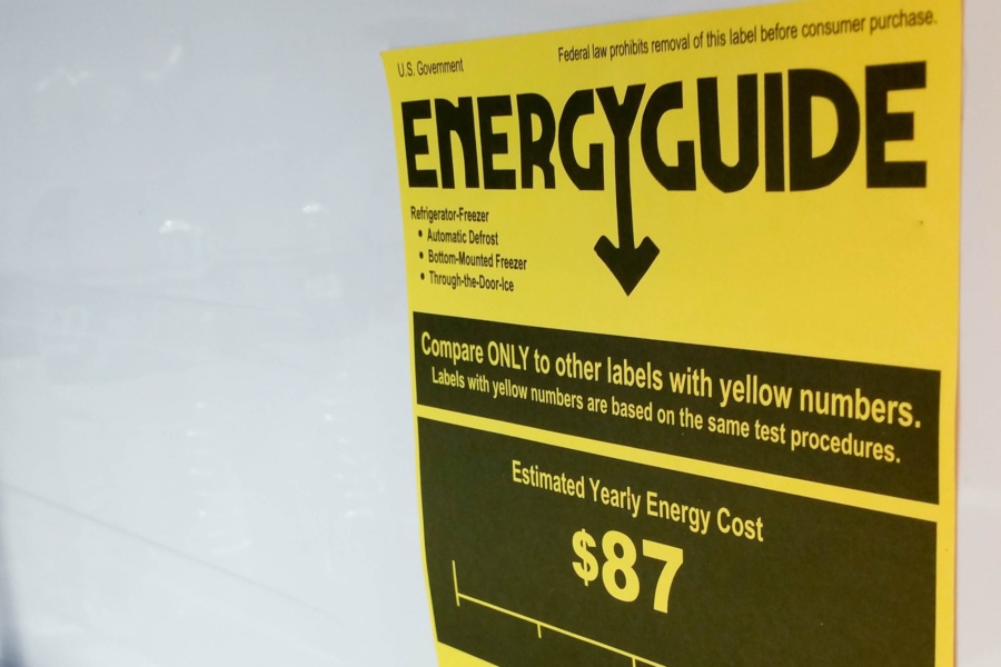 Eugene, OR, USA - December 17, 2016; A EnergyGuide label inside a refrigerator in Eugene, OR. A EnergyGuide gives consumers the yearly operating cost for the appliance. The Energy Policy and Conservation Policy of 1975, which is regulated by the Federal Trade Commission (FTC) to make sure consumers are aware of costs of major appliances and lighting.