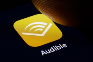 In this photo illustration the logo of Amazon Audible is displayed on a smartphone