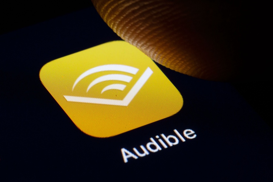 In this photo illustration the logo of Amazon Audible is displayed on a smartphone