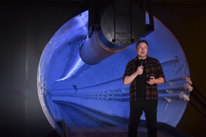 Elon Musk, co-founder and chief executive officer of Tesla Inc., speaks during an unveiling event for the Boring Company Hawthorne test tunnel in Hawthorne, south of Los Angeles, California on December 18, 2018. - Musk explained that the snail moves 14 times faster than a tunnel-digging machine. On Tuesday night December 18, 2018, Boring Co. officially opened the Hawthorne tunnel, a preview of Elon Musk's larger vision to ease L.A. traffic. (Photo by Robyn Beck / POOL / AFP) (Photo credit should read ROBYN BECK/AFP via Getty Images)