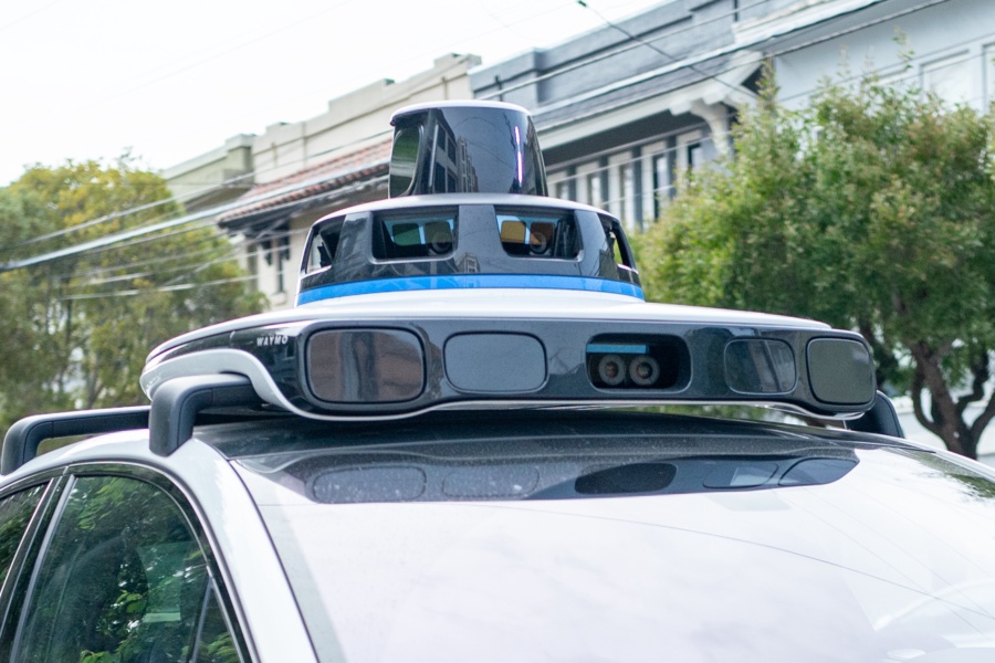 A Waymo self-driving car is seen in the Inner Richmond neighborhood of San Francisco, California, with the Lidar unit on the vehicle visible, November 17, 2024. (Photo by Smith Collection/Gado/Getty Images)