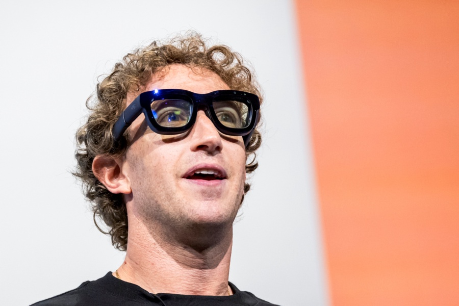 Mark Zuckerberg, chief executive officer of Meta Platforms Inc., wears Orion augmented reality (AR) glasses during the Meta Connect event in Menlo Park, California, US, on Wednesday, Sept. 25, 2024. Meta Platforms Inc. debuted its first pair of augmented reality glasses, devices that show a combined view of the digital and physical worlds, a key step in Chief Executive Officer Mark Zuckerberg's goal of one day offering a hands-free alternative to the smartphone. Photographer: David Paul Morris/Bloomberg via Getty Images