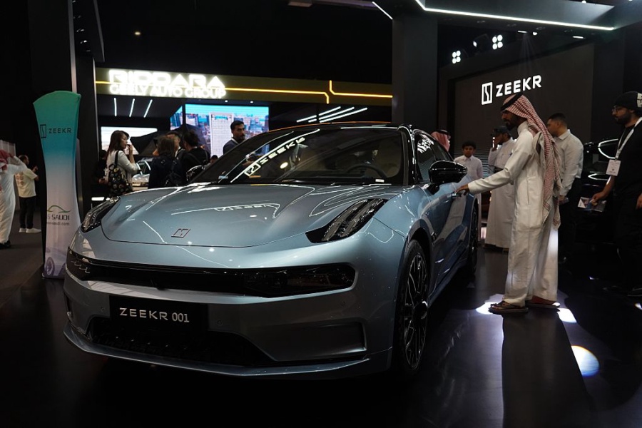 A man views a car from Zeekr during the EVS Saudi Arabia 2025 exhibition in Riyadh, Saudi Arabia, May 4, 2025. The three-day event kicked off here on Sunday, attracting several Chinese brands. (Photo by Luo Chen/Xinhua via Getty Images)