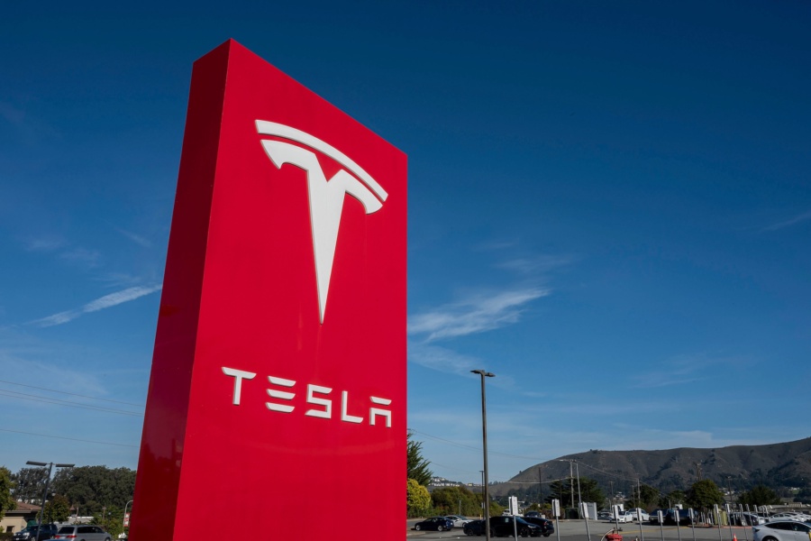 Signage at a Tesla store in Colma, California on Jan. 2, 2025. Photographer: David Paul Morris/Bloomberg