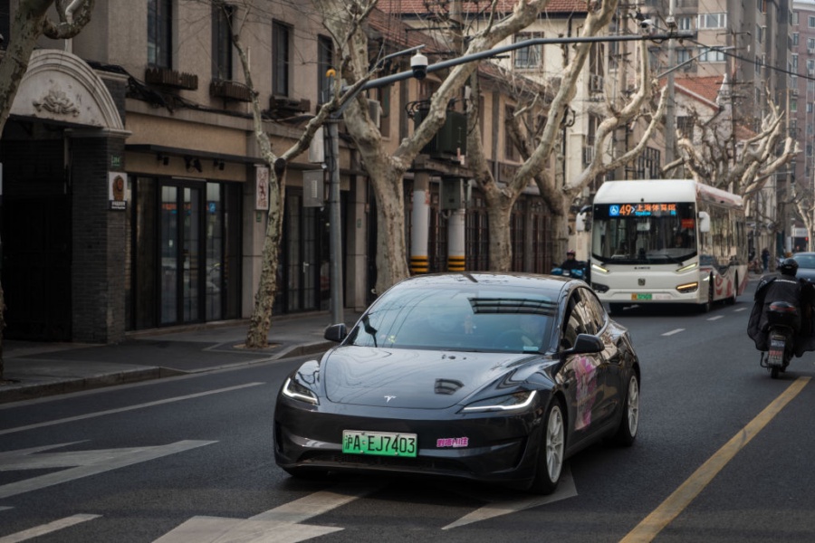 SHANGHAI, CHINA - FEBRUARY 27: Tesla Model 3 vehicle drives on the street on February 27, 2025 in Shanghai, China. Tesla has started rolling out driving-assistance features to some cars in China that are similar to the Full Self-Driving (FSD) system in the US. (Photo by Dai Aochen/VCG via Getty Images)
