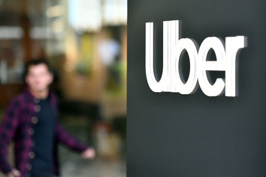 An Uber logo is seen on a sign outside the company's headquarters