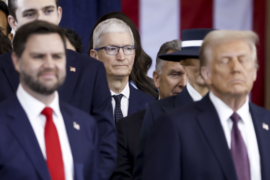 WASHINGTON, DC - JANUARY 20: Apple CEO Tim Cook (C) seen behind US President Donald Trump (R) and US Vice President JD Vance (L) after the two were sworn into office at an inauguration ceremony in the rotunda of the United States Capitol on January 20, 2025 in Washington, DC. Donald Trump takes office for his second term as the 47th President of the United States. (Photo by Shawn Thew-Pool/Getty Images)