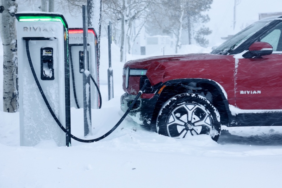 Rivian truck recharges at a Rivian electric vehicle charging station during a snowstorm on March 3, 2024 in Truckee, California.