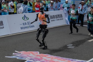 BEIJING, CHINA - APRIL 19: A Humanoid robot called Tiangong runs after the finish line in the Beijing E-Town Humanoid Robot Half Marathon on April 19, 2025 in Beijing, China. According to organizers, the event was the first of its kind and featured twenty-one humanoid robot runners. (Photo by Kevin Frayer/Getty Images)
